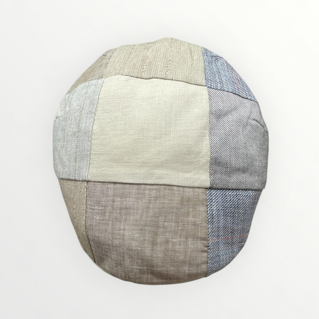 Coppola Tindari by Sbarià featuring a stylish, wide-brimmed hat in neutral tones, perfect for sun protection and fashion.