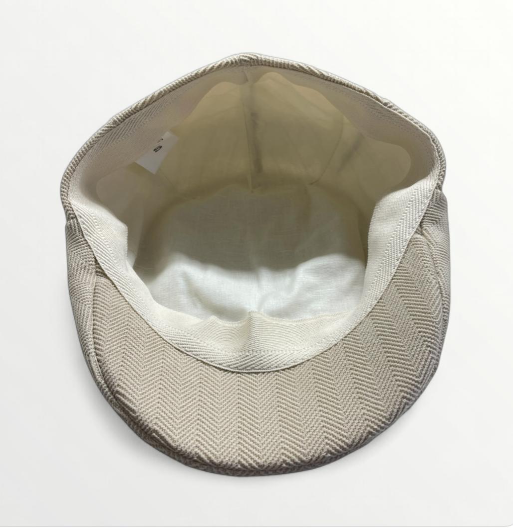 Coppola Zankle by Sbarià featuring traditional design with woven fabric and decorative details, displayed on a mannequin head.