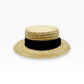 Natural straw boater hat by Sbarià with a black band, handcrafted woven design, seen from a three-quarter view, made in Italy.
