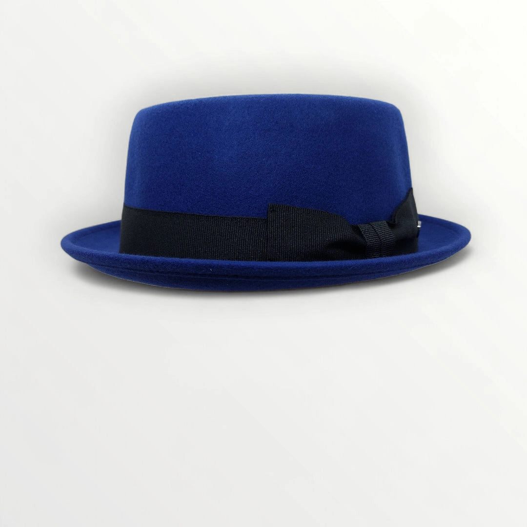 Sbarià waterproof wool felt pork pie hat in petrol blue with a ribbon and bow, crushable and stylish for versatile wear.