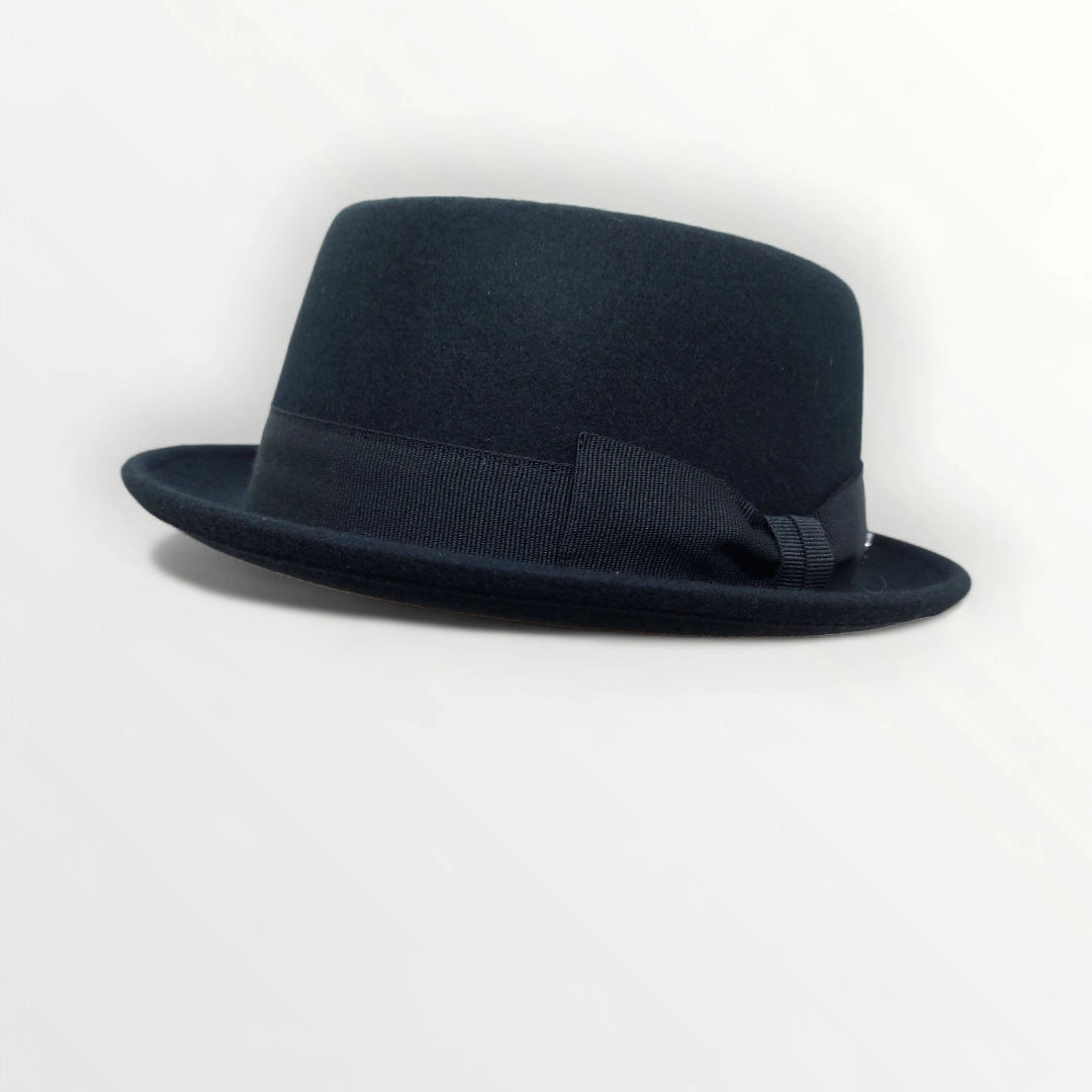 Black felt pork pie hat with ribbon and bow, waterproof and crushable, by Sbarià, stylish and durable accessory for men and women.