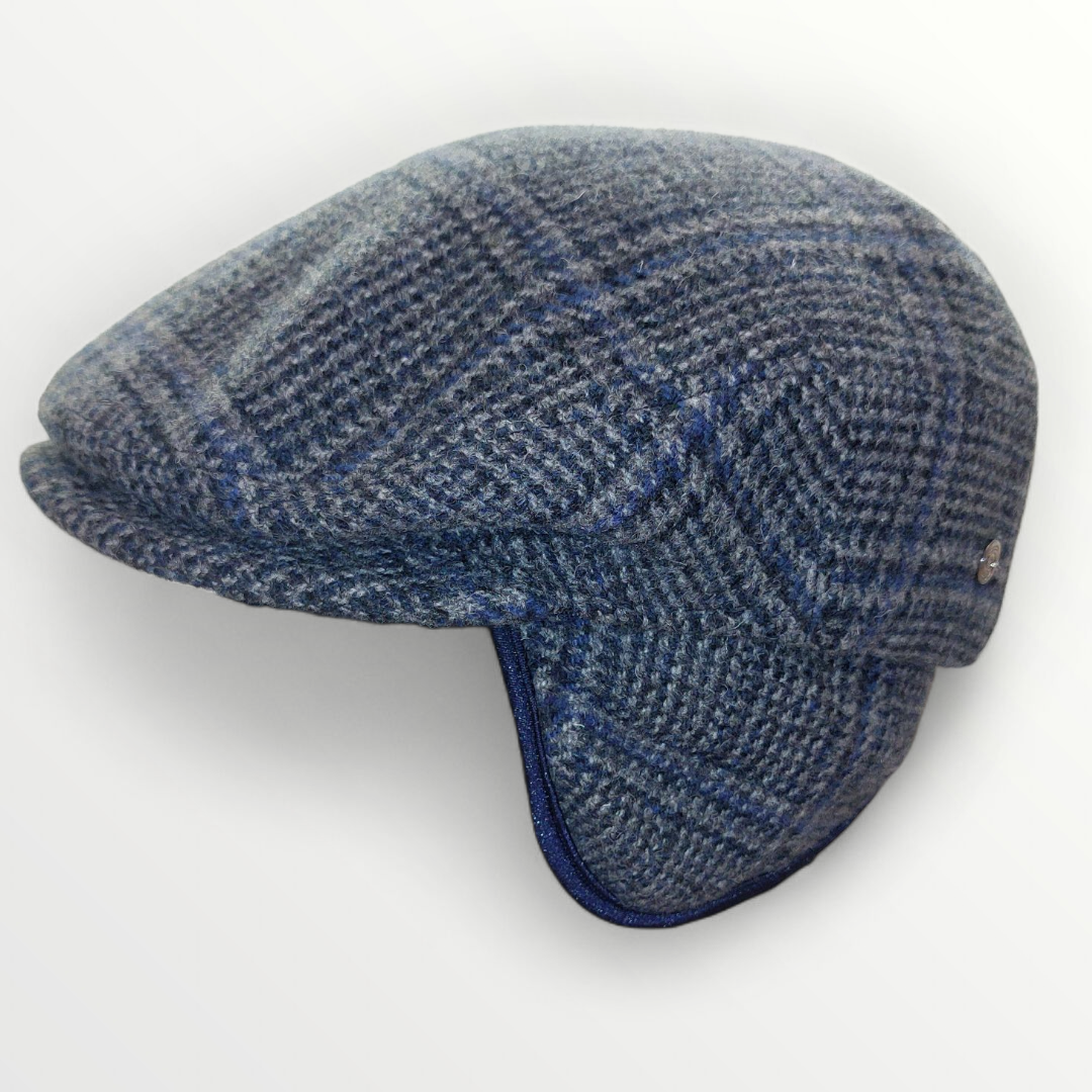 Sbarià Siciliana wool cap with gray plaid and blue stripes, featuring a cozy ear cover for warmth and traditional style.