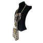 Gold Mystic Fish Cravatta Gioiello by Claudia De Rosa Jewelry displayed on a mannequin. Elegant jewelry piece with intricate design.