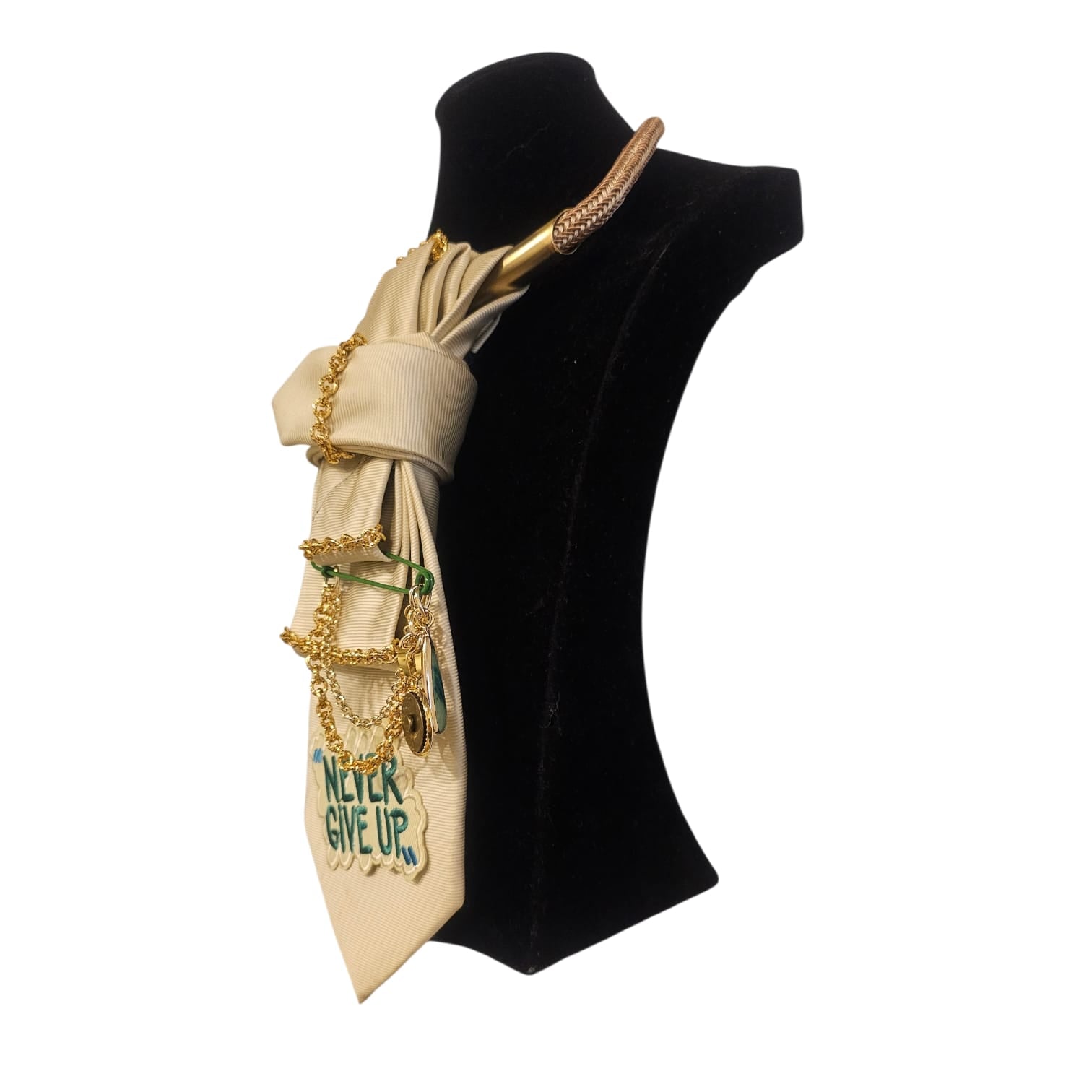 Claudia De Rosa Jewelry Cravatta Gioiello with "Never Give Up" pendant displayed on a mannequin in a side view.