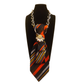 Claudia De Rosa Jewelry Cravatta Gioiello with vibrant red and orange stripes, elegant silk necktie accessory.