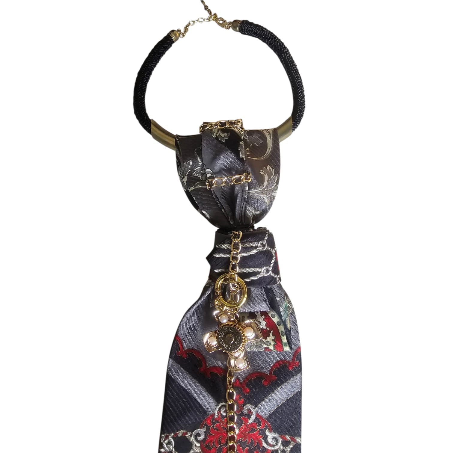 Close-up of CLAUDIA DE ROSA JEWELRY Cravatta Gioiello with Imperial Cross pendant and detailed jewelry design.
