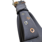 Close-up of the Rebel Grey Cravatta Gioiello by Claudia De Rosa Jewelry showing intricate jewel insert details on the tie.