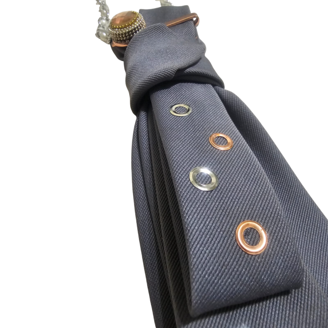 Close-up of the Rebel Grey Cravatta Gioiello by Claudia De Rosa Jewelry showing intricate jewel insert details on the tie.