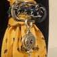 Close-up of CLAUDIA DE ROSA JEWELRY Cravatta Gioiello with intricate knot design and sparkling details.
