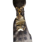 Close-up of Claudia De Rosa Jewelry Mystic Fish Gold Cravatta Gioiello with intricate knot detail and gold finish.