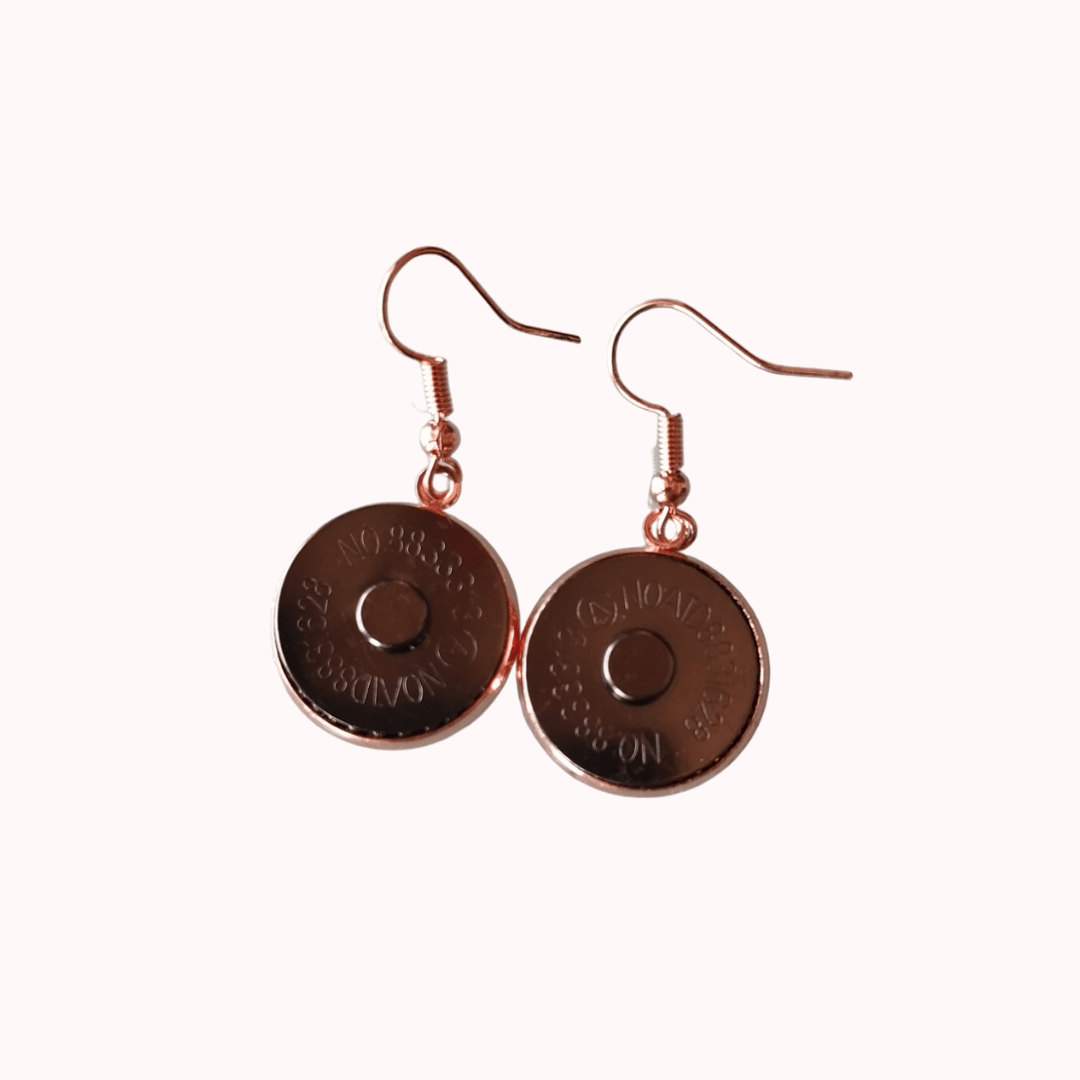 Claudia De Rosa Jewelry magnetic earrings with pink gold-tone pendants, stylish and delicate accessory for pierced ears.