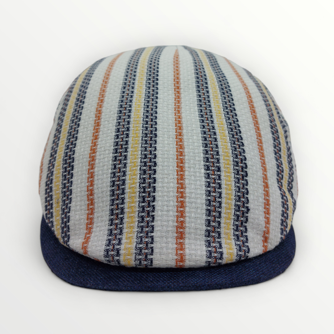 Primavera/Estate Coppola hat made from linen and cotton, featuring a wide brim and breathable fabric for summer wear.