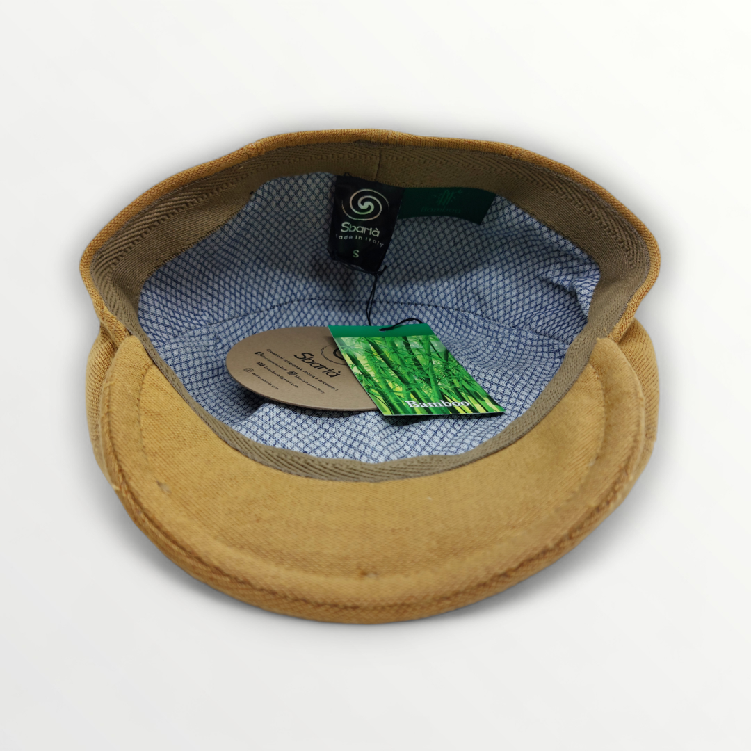 Coppola Primavera/Estate Bambù in camel color with a woven design, styled for a casual, summery look.