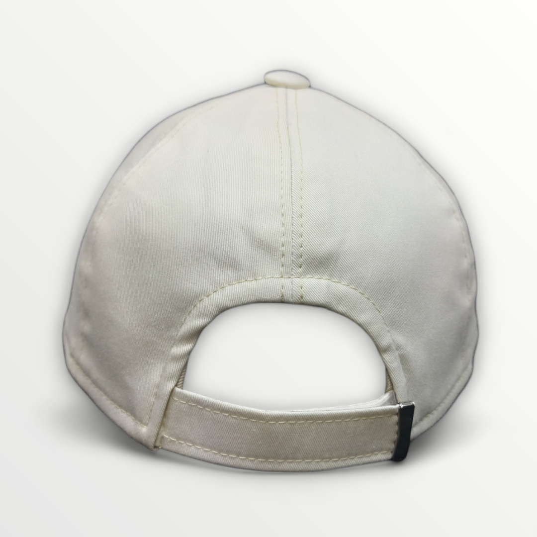 Cotton baseball cap by Casmik from Primavera/Estate collection, shown in a natural profile with a curved brim and adjustable strap.