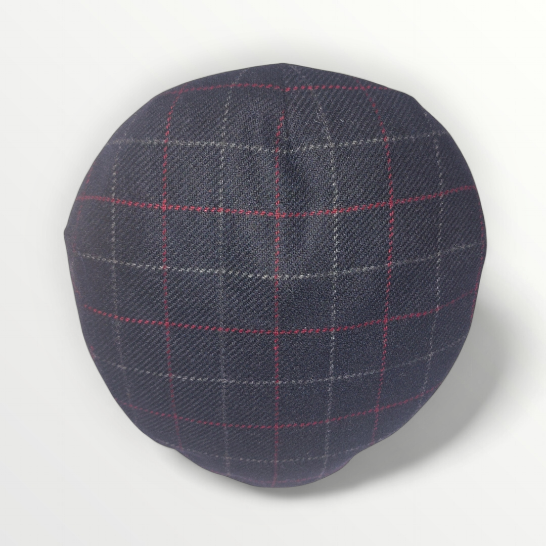 Black pure wool Coppola hat by Autunno/Inverno with subtle gray and red plaid pattern, stylish and warm winter accessory.