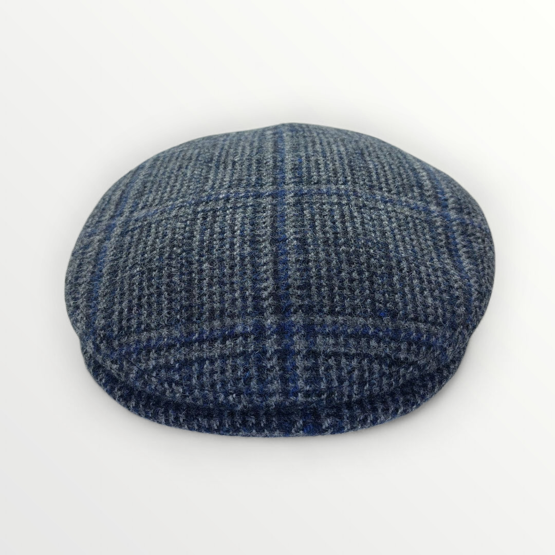 Sbarià Siciliana wool cap with gray plaid and blue stripe pattern, featuring ear cover for warmth and style.