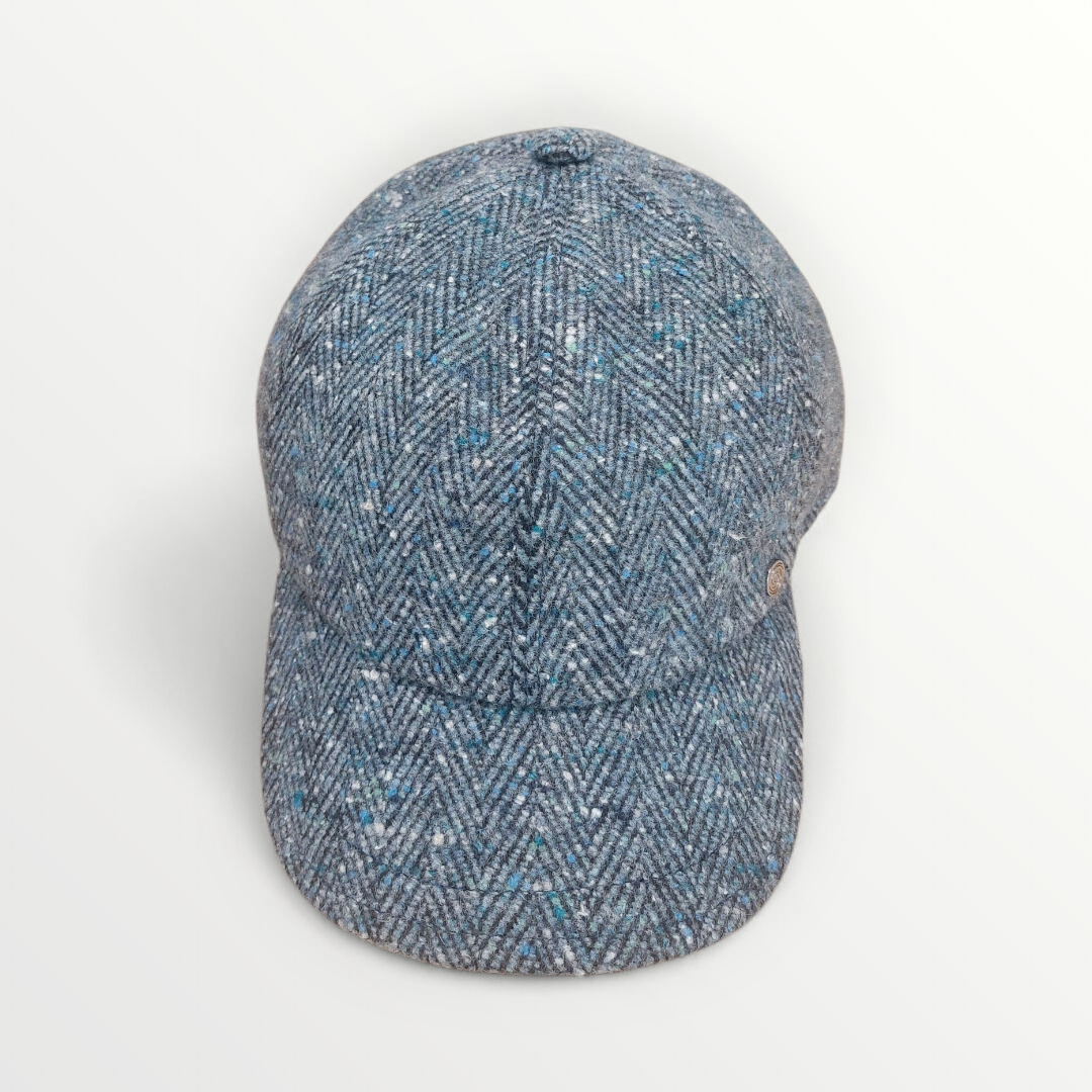 Sbarià blue herringbone knit cap, a stylish baseball berretto made of soft lana fabric, displayed on a neutral background.