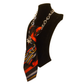 Lateral view of Claudia De Rosa Jewelry Cravatta Gioiello Stripes Fire, a stylish decorative tie accessory on a mannequin