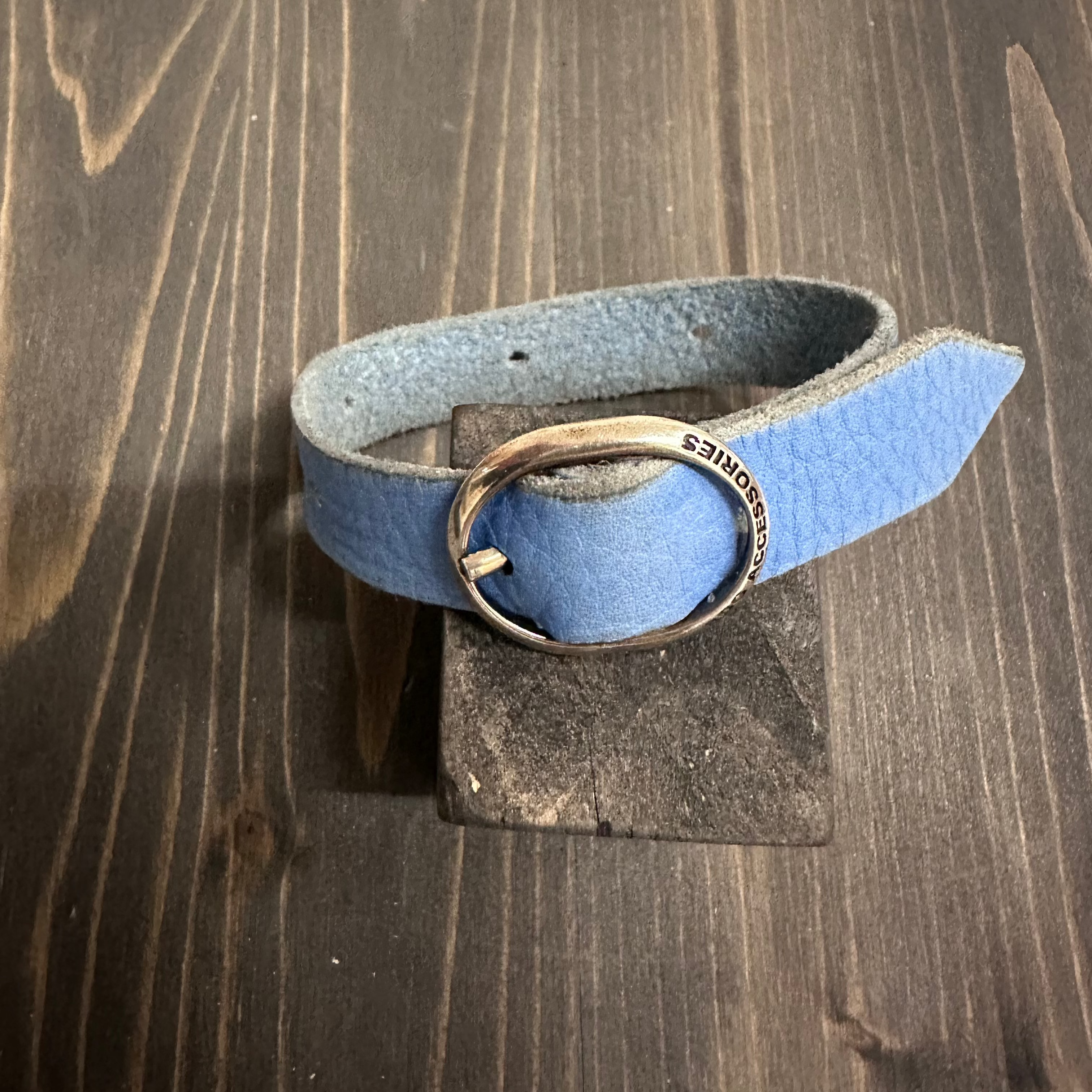 Blue and red BDG Accessories ellipse bracelet featuring elegant wooden design, worn on a wrist.