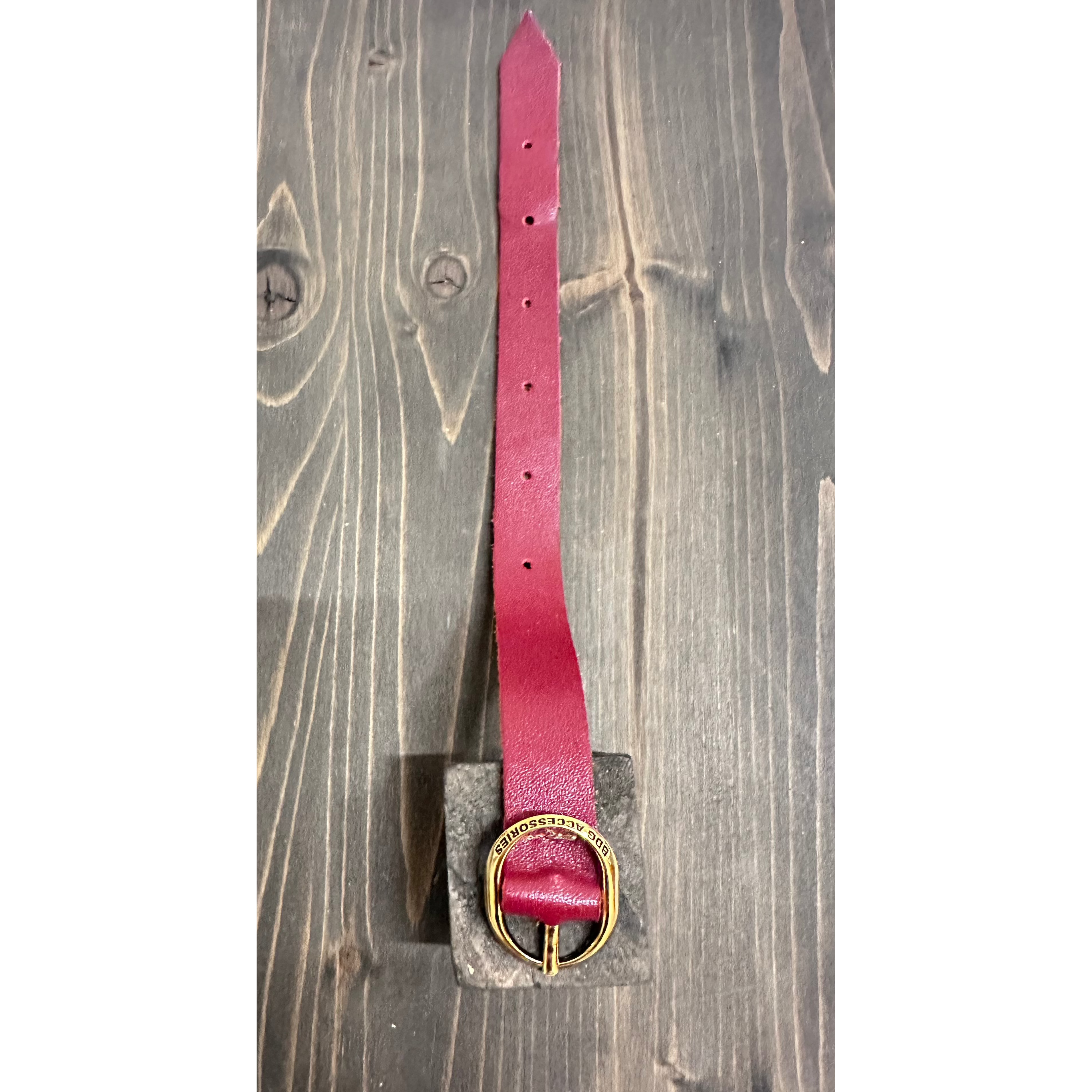 Elegant BDG Accessories ellipse bracelet in red and blue with detailed strap design, showcasing a stylish accessory.