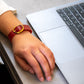 Elegant BDG Accessories bracelet with red and blue elliptical design, featuring a stylish and modern jewelry piece.