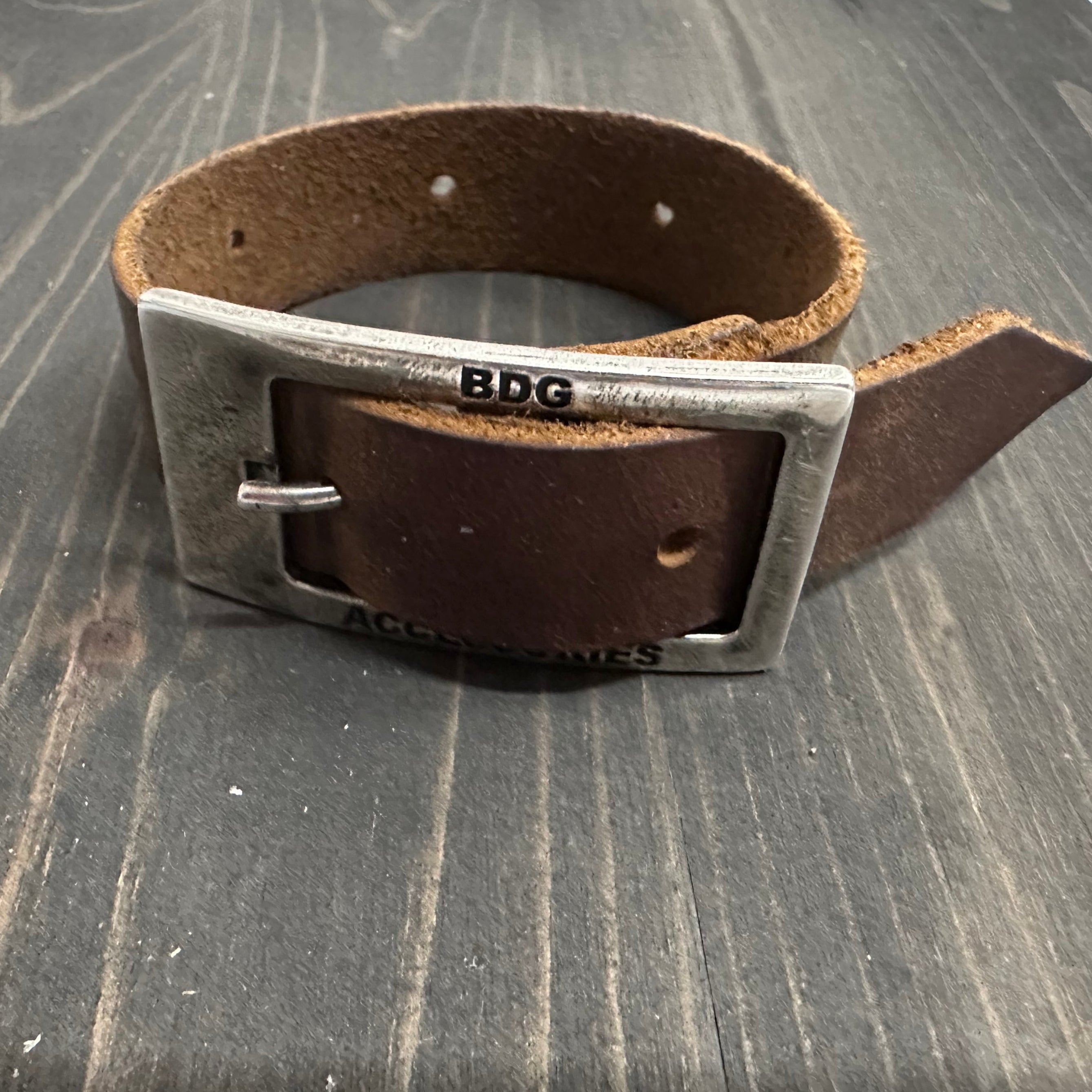 BDG Accessories leather bracelet in old style with rustic design and adjustable strap, crafted from brown leather.