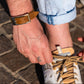 BDG Accessories brown leather bracelet in old style, featuring a smooth, classic design worn on the wrist.