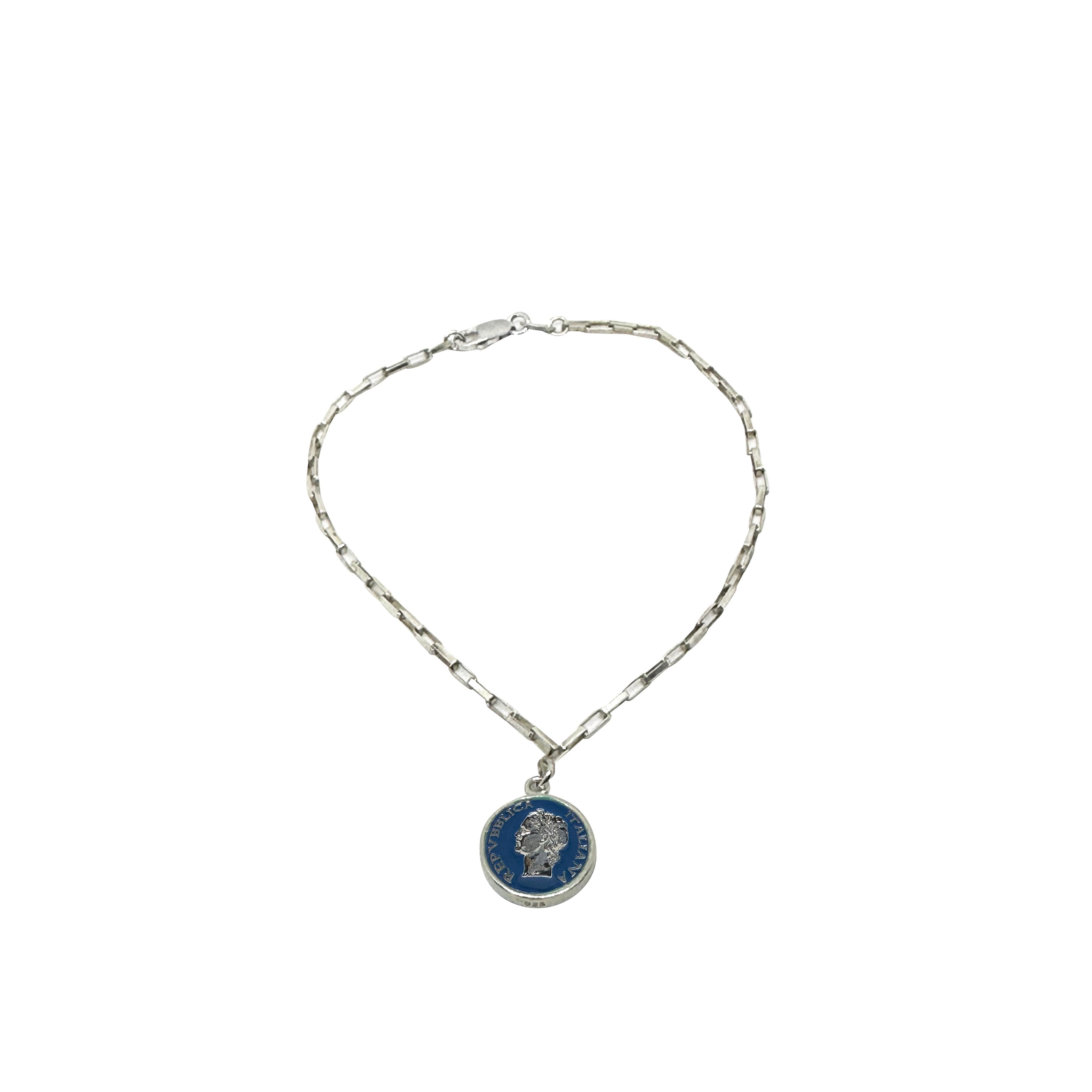 Vintage BDG Accessories silver bracelet with dark blue enamel medallion, 1950s Dolce Vita style, detailed profile design.