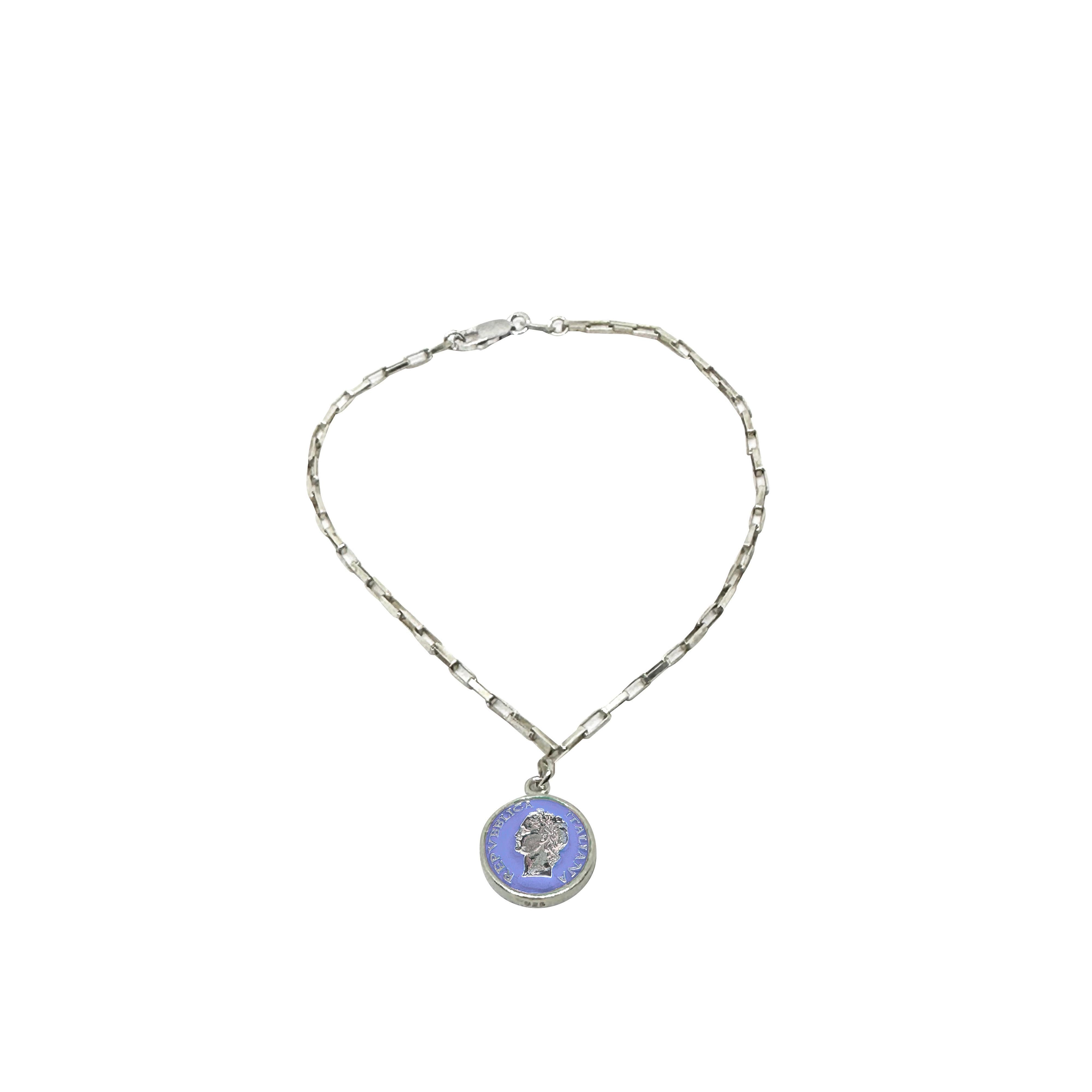 Silver bracelet with colorful enamel accents inspired by 1950s vintage style, featuring medallion and profile design.