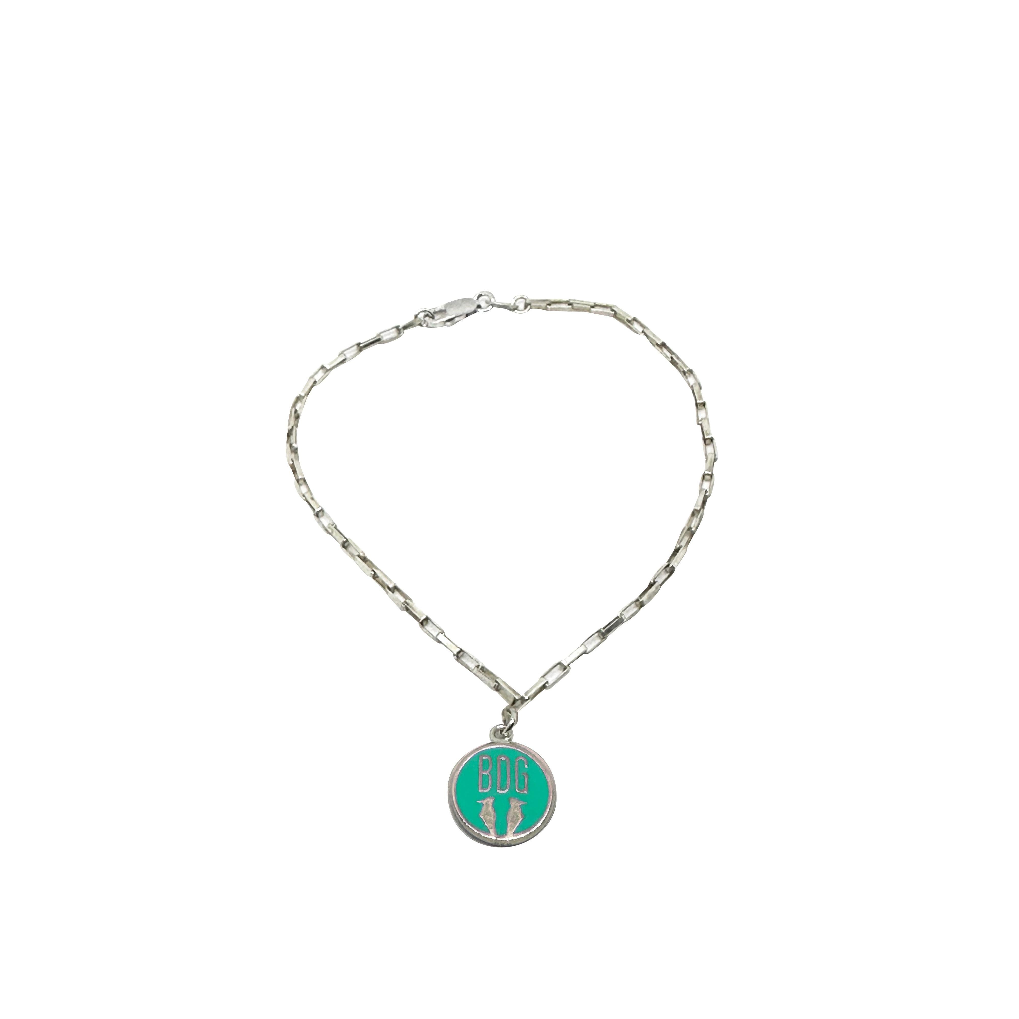 Vintage BDG Accessories silver bracelet with colorful enamel and a green medallion inspired by 1950s Dolce Vita style.