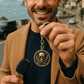 Silver keychain with black sails design from BDG Accessories, featuring a detailed nautical-inspired motif.