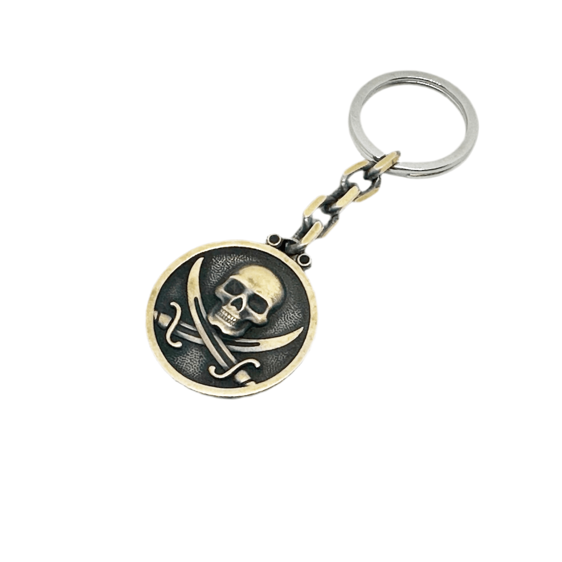 Silver keychain with black sails design from BDG Accessories, featuring a detailed nautical motif.