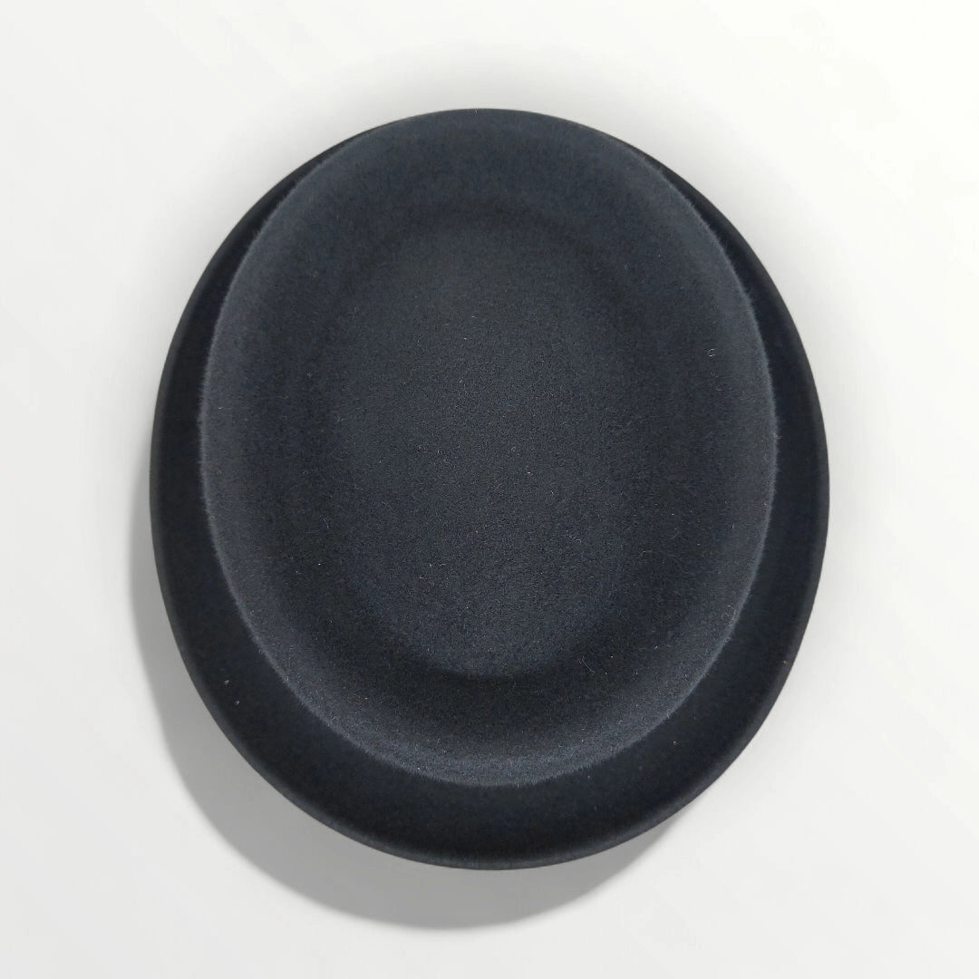 Black felt wool pork pie hat with ribbon and bow by Sbarià, waterproof and crushable for stylish comfort.