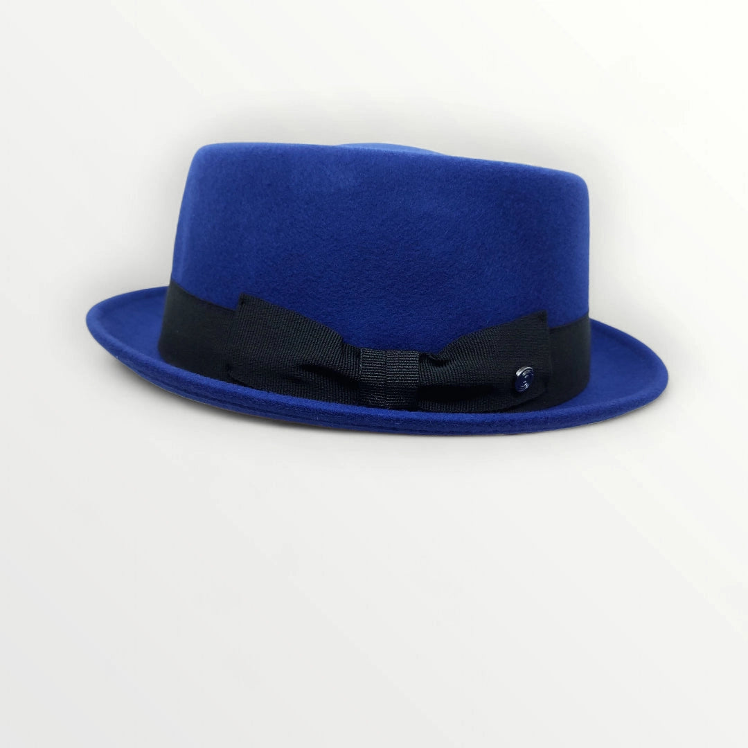 Sbarià wool felt pork pie hat in petrol blue with a satin ribbon and bow, waterproof and crushable for stylish wear.