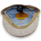 Sbarià beige linen and cotton flat cap with a subtle micro-pattern and tan trim. Interior is light blue with a patterned lining.