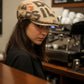 Sbarià Coppola Bang hat made from recycled coffee sack jute with beige linen brim and cotton lining. Features bold black lettering.