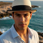 Sbarià natural paper straw bowler hat with black grosgrain band and brim trim, perfect for summer.