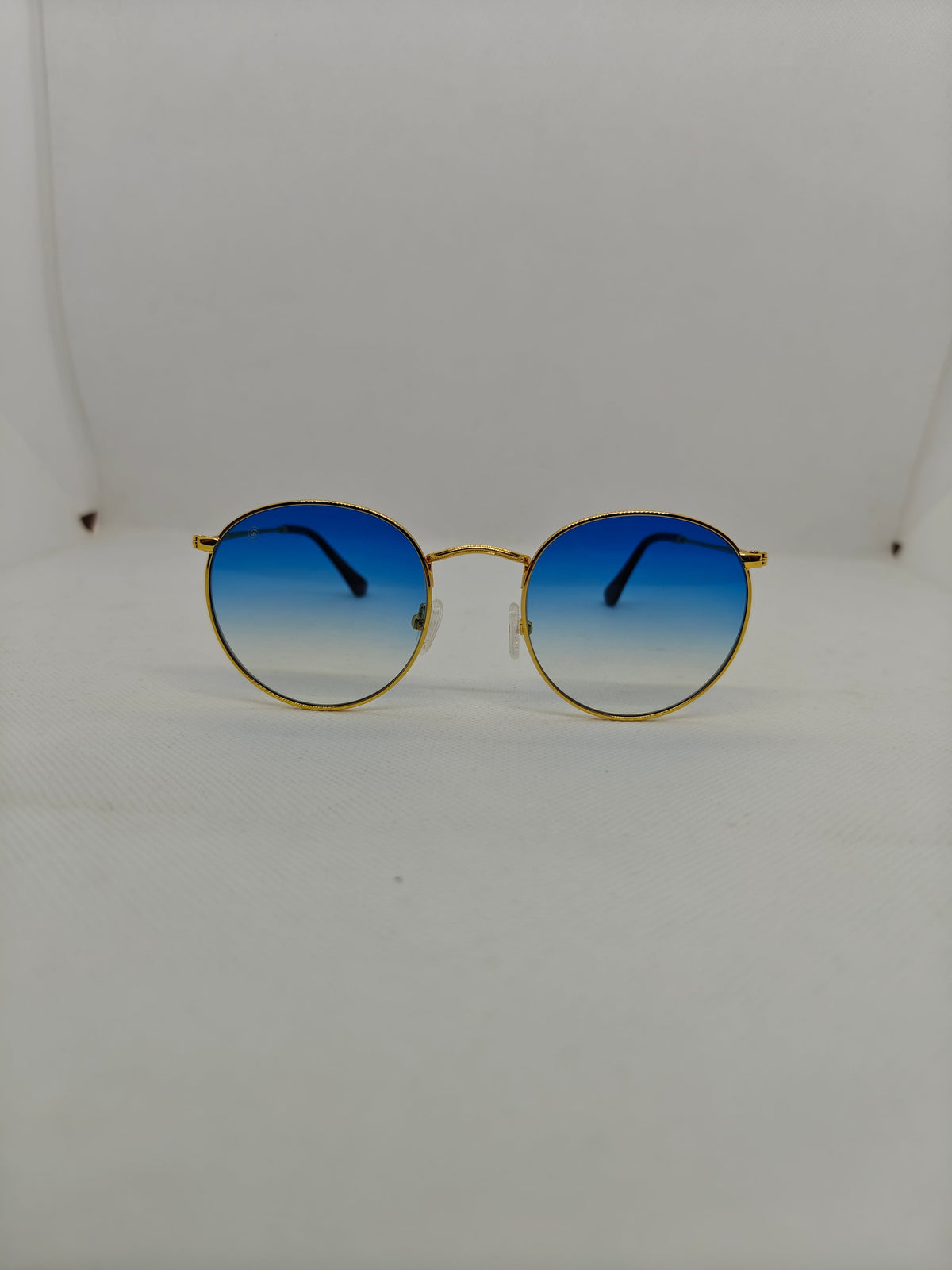 Occhiali da sole rotondi Sbarià con montatura in alpacca dorata e lenti sfumate blu in stile vintage anni 70