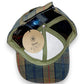 Sbarià British tartan baseball cap in water-repellent waxed cotton with adjustable strap and structured brim.