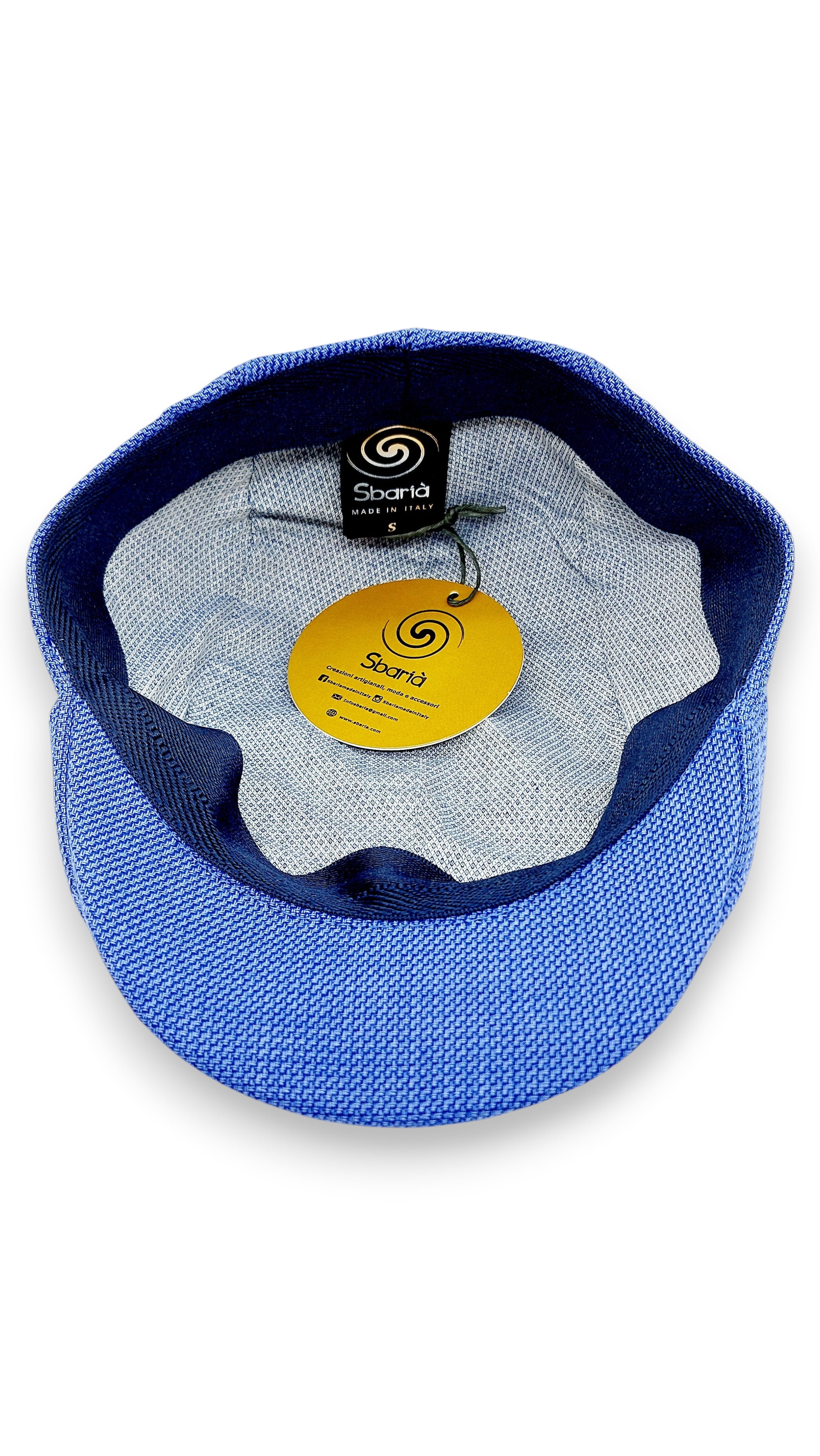 Sbarià blue cotton flat cap with artisanal craftsmanship and UV protection.