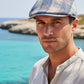 Sbarià men's blue and beige plaid flat cap made of linen and cotton, with a short brim.