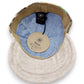Sbarià baseball cap made from recycled coffee jute and natural beige linen, with a blue cotton lining. Adjustable strap.
