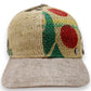 Sbarià baseball cap made from recycled coffee jute with a beige linen brim and adjustable strap. Features colorful graphic print.