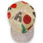 Sbarià baseball cap made from recycled coffee jute with red and black print. Natural linen brim and adjustable strap.