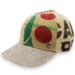 Sbarià baseball cap made from recycled coffee jute and natural beige linen. Features red circles and green accents.