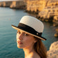 Sbarià natural paper straw bowler hat with black grosgrain band and brim trim, perfect for summer.